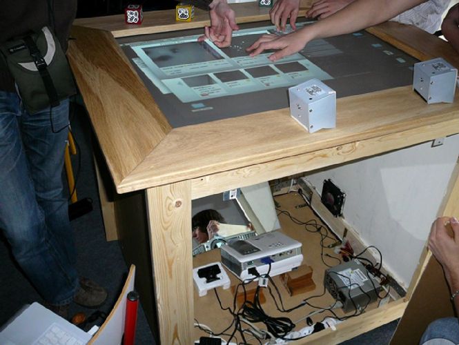 2010 - This is a multitouch table designed and built during high school with the help of other enthusiastic geeks. It's basically a giant iPad made of wood at a time when iPhones were still quite a new thing. We almost won an high school grade physics Olympiad with it.